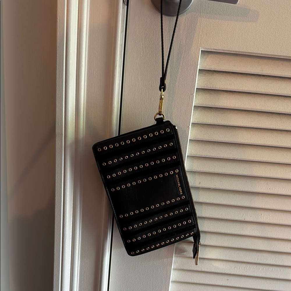 Michael Kore Black Wristlet with Gold Grommet Accents